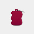 Distributeur de friandises en silicone à presser bordeaux