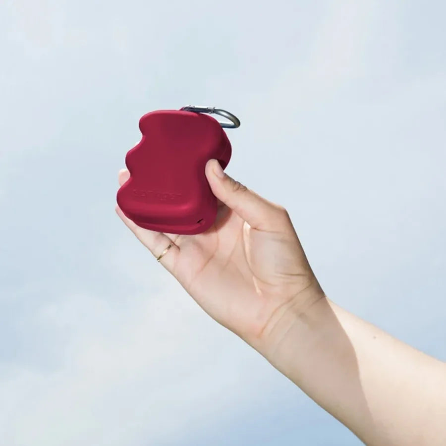 Distributeur de friandises en silicone à presser bordeaux